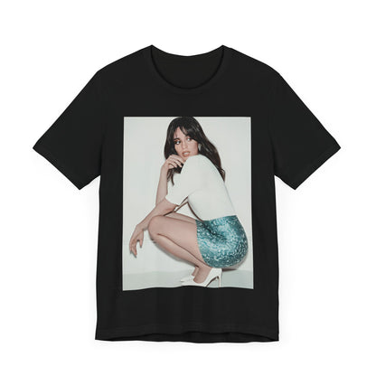 A black graphic t-shirt featuring a stylized graphic of Camila Cabello as a Latin pop princess.