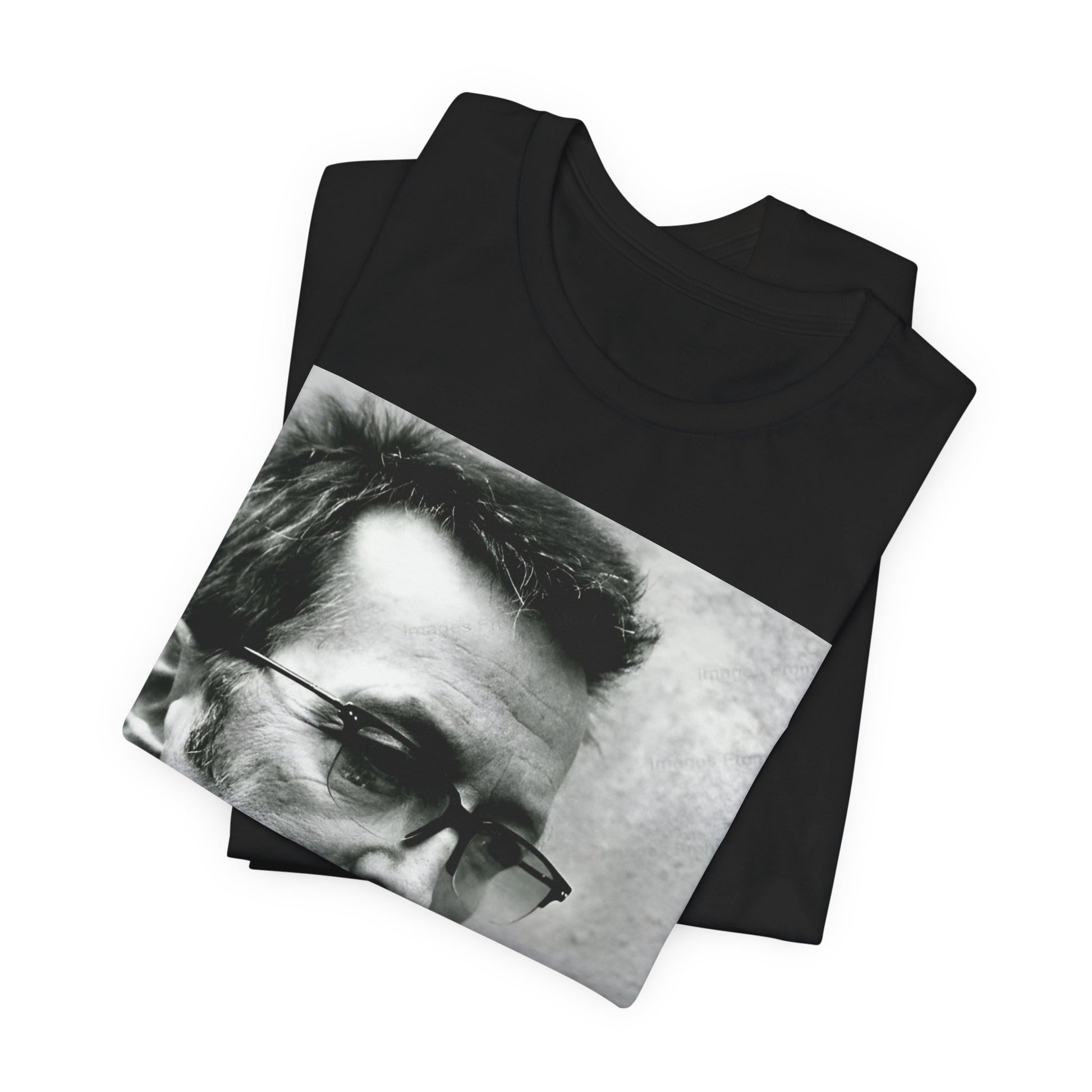A black graphic t-shirt featuring a black and white, monochrome graphic or photo of Eric Clapton.