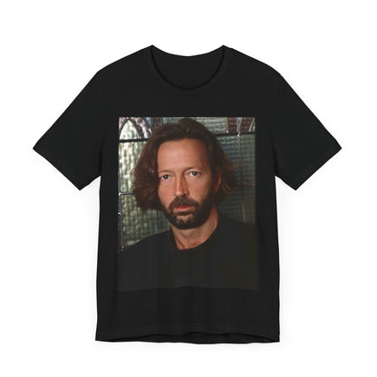 A black graphic t-shirt featuring a portrait graphic of Eric Clapton as a guitar god legend.