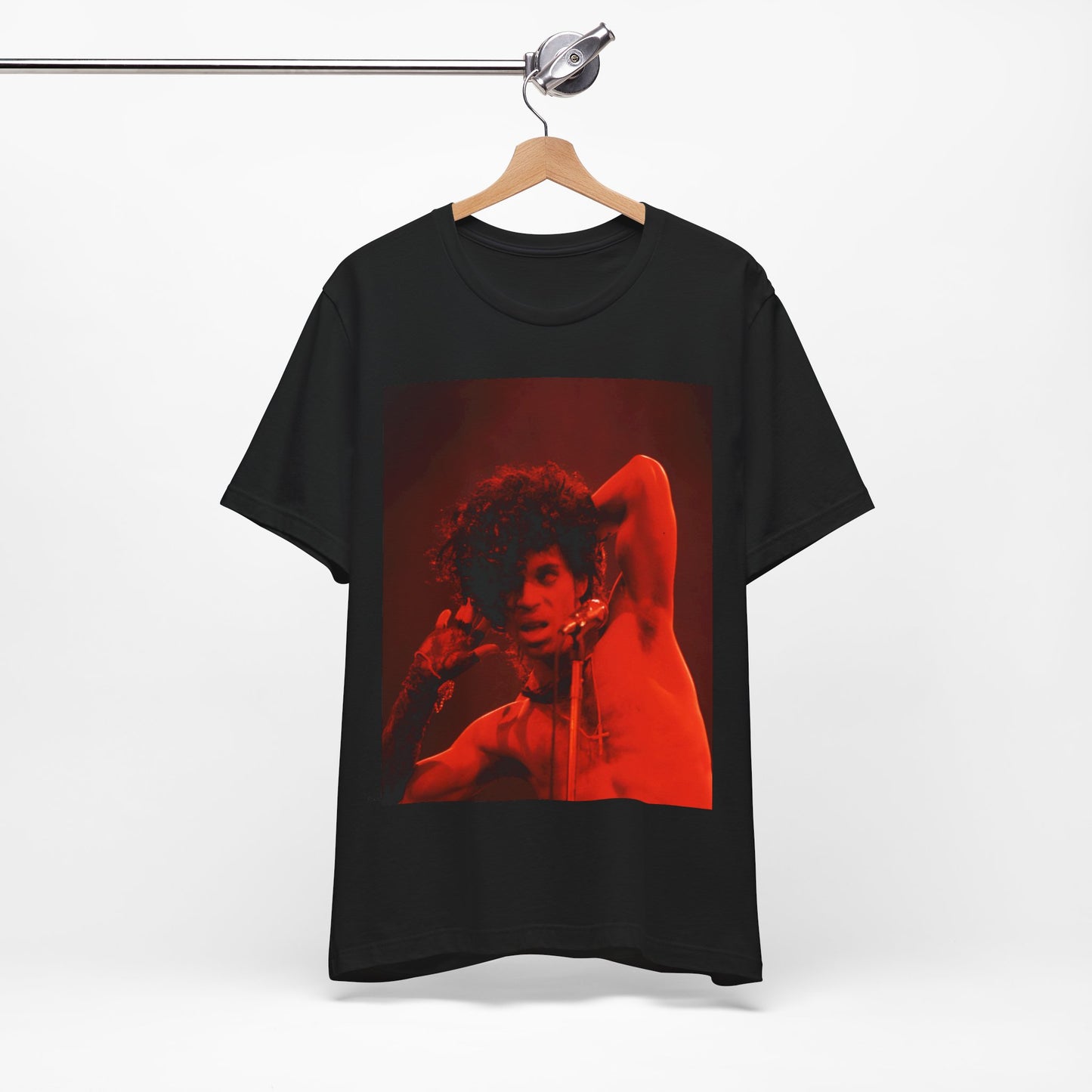 A black graphic t-shirt featuring a concert pop fan graphic of Prince.