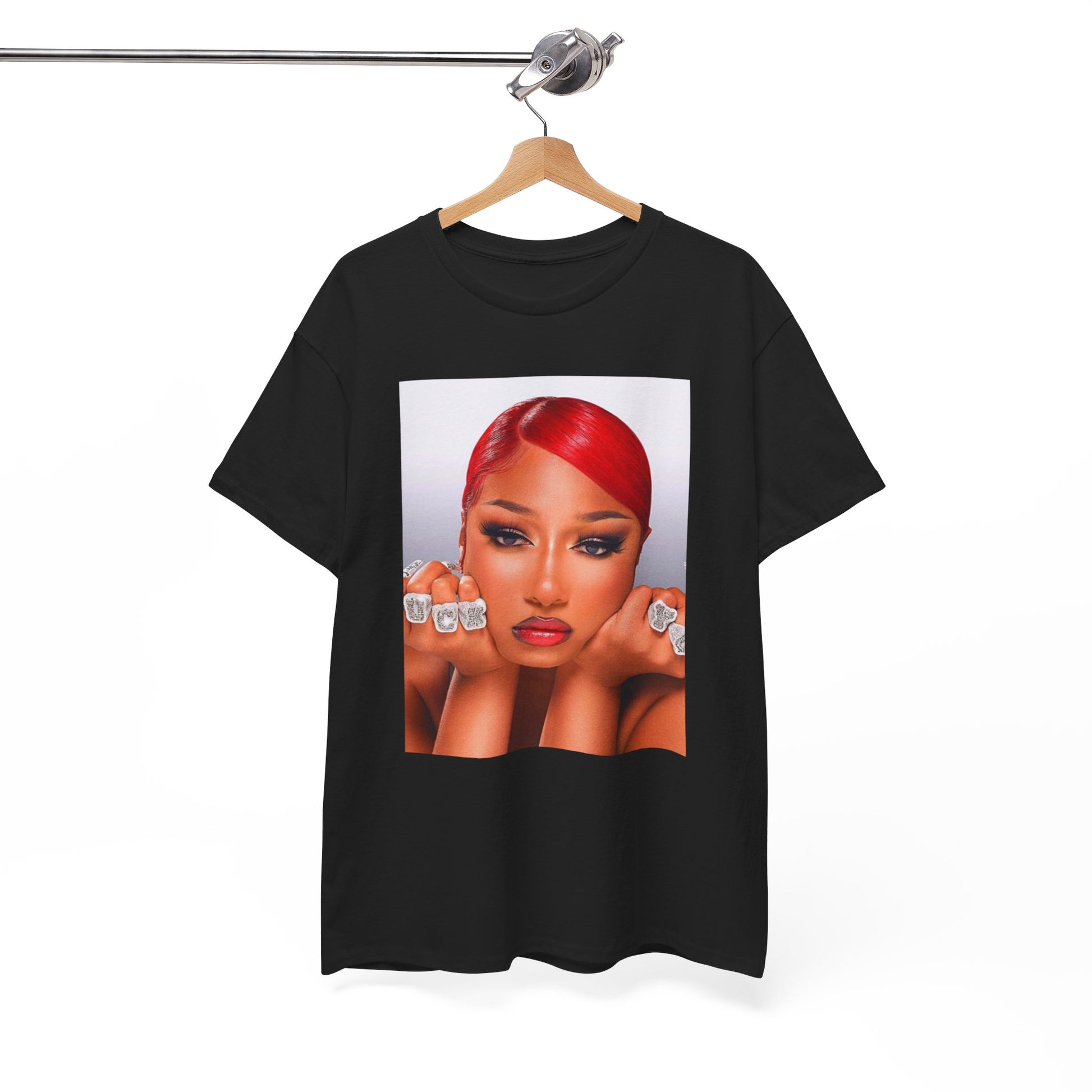 A black graphic t-shirt featuring a bold graphic of Megan Thee Stallion as a rap superstar.