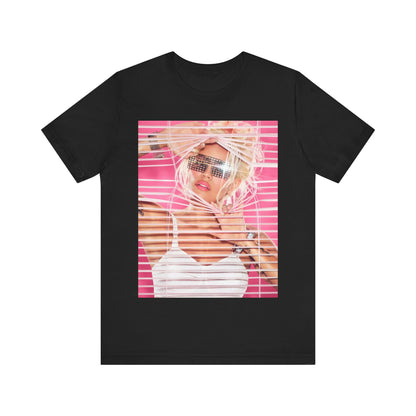 A black graphic t-shirt featuring a graphic of Karol G in a cool Latin trap style.