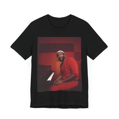 A black graphic t-shirt featuring a retro photo of Marvin Gaye playing the piano.