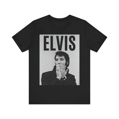 A black graphic t-shirt featuring a retro graphic of Elvis Presley as a 'Rebel With A Cause.'