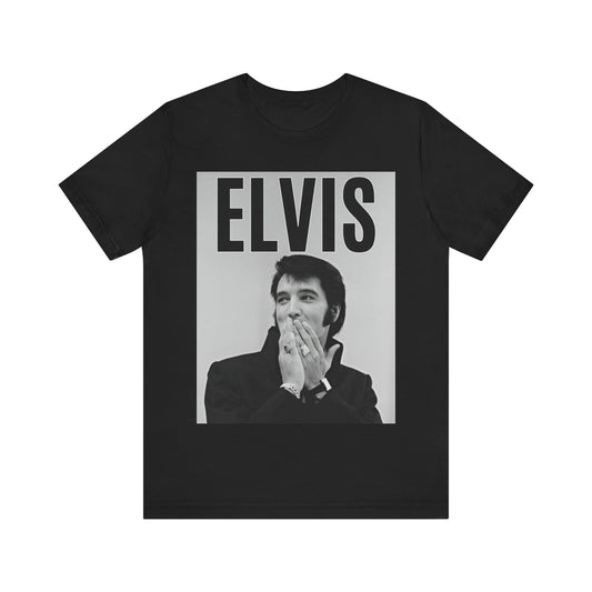 A black graphic t-shirt featuring a retro graphic of Elvis Presley as a 'Rebel With A Cause.'