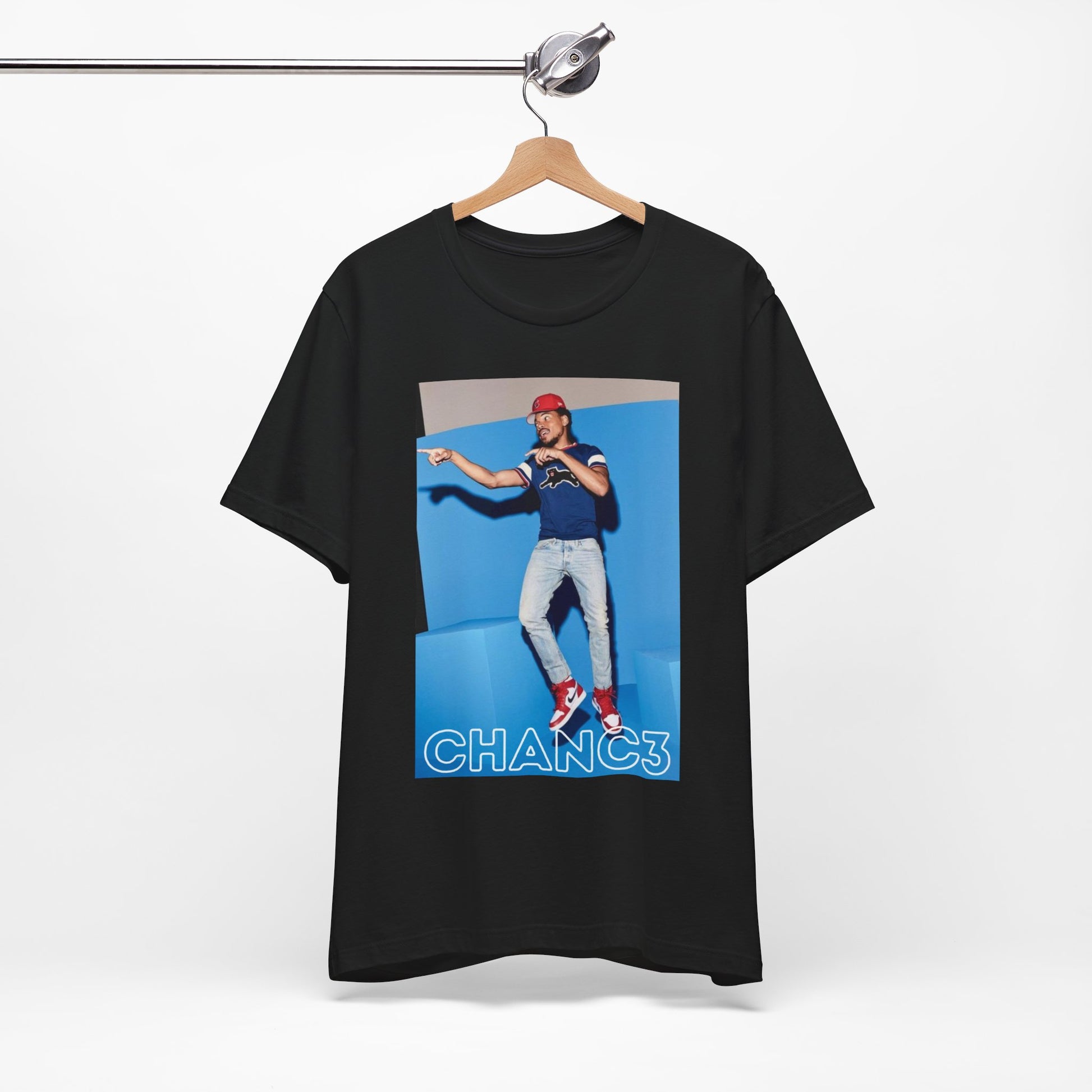 A black graphic t-shirt featuring a graphic of Chance the Rapper emphasizing his gospel rap style.