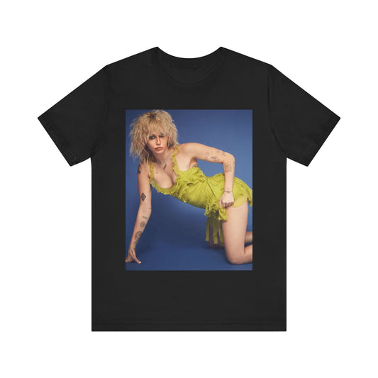 A black graphic t-shirt featuring a graphic of Miley Cyrus as a global pop phenomenon.