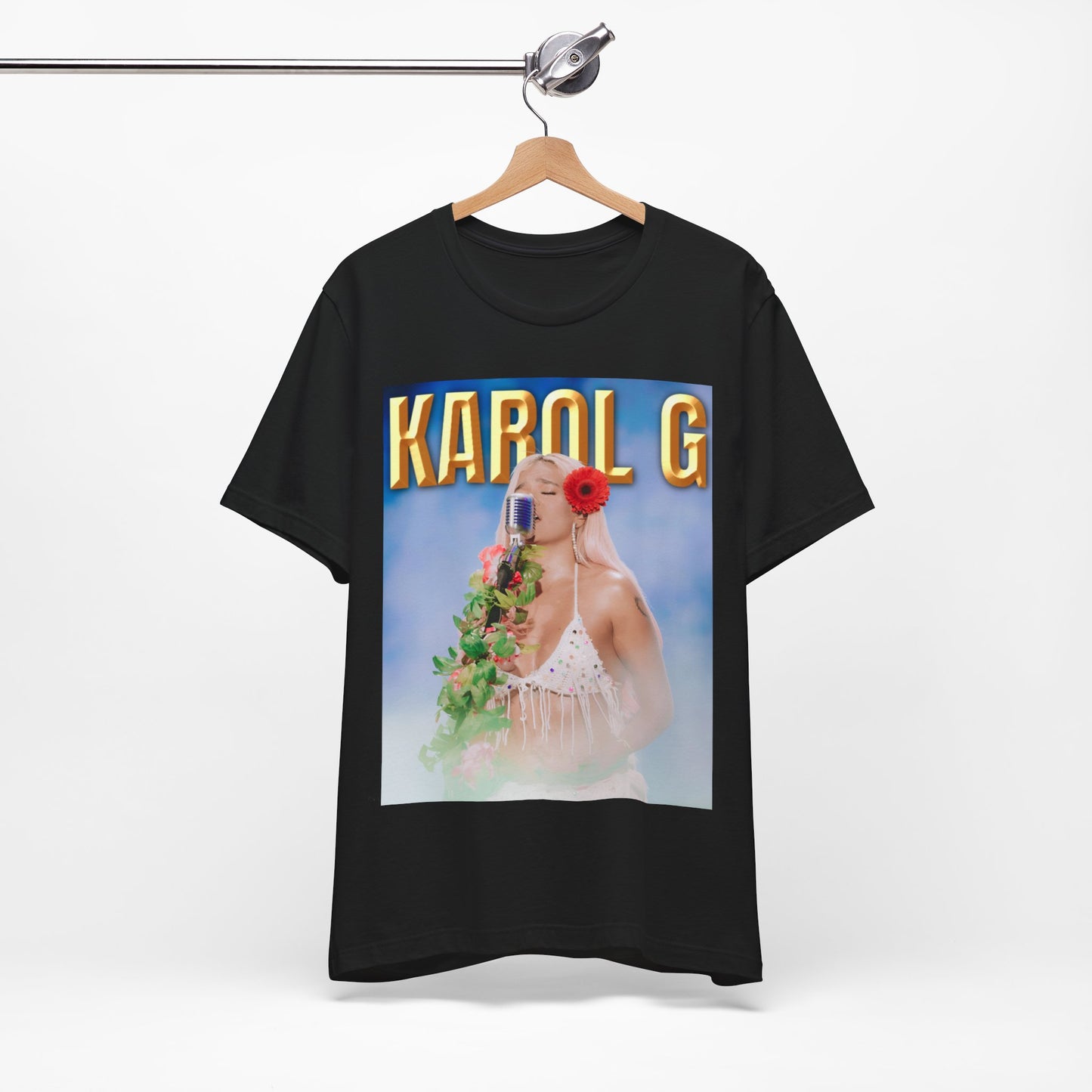 A black graphic t-shirt featuring a graphic of Karol G as a classic Latin pop queen.