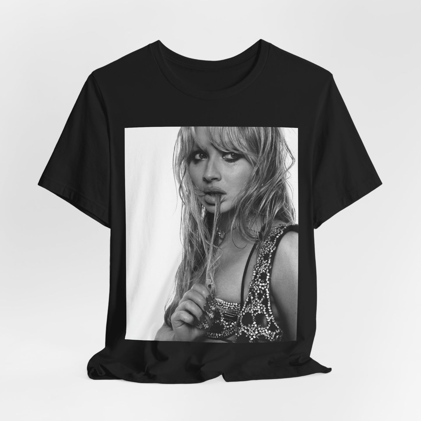 A black graphic t-shirt featuring a black and white portrait photo of Sabrina Carpenter.