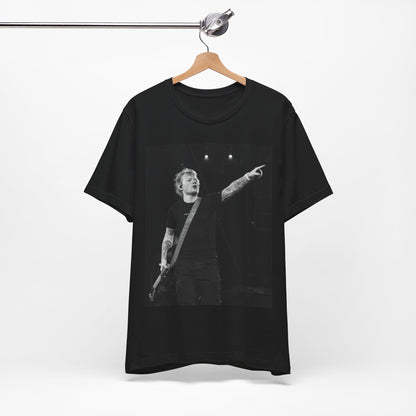 A black graphic t-shirt featuring a black and white graphic or photo of Ed Sheeran performing live on stage.