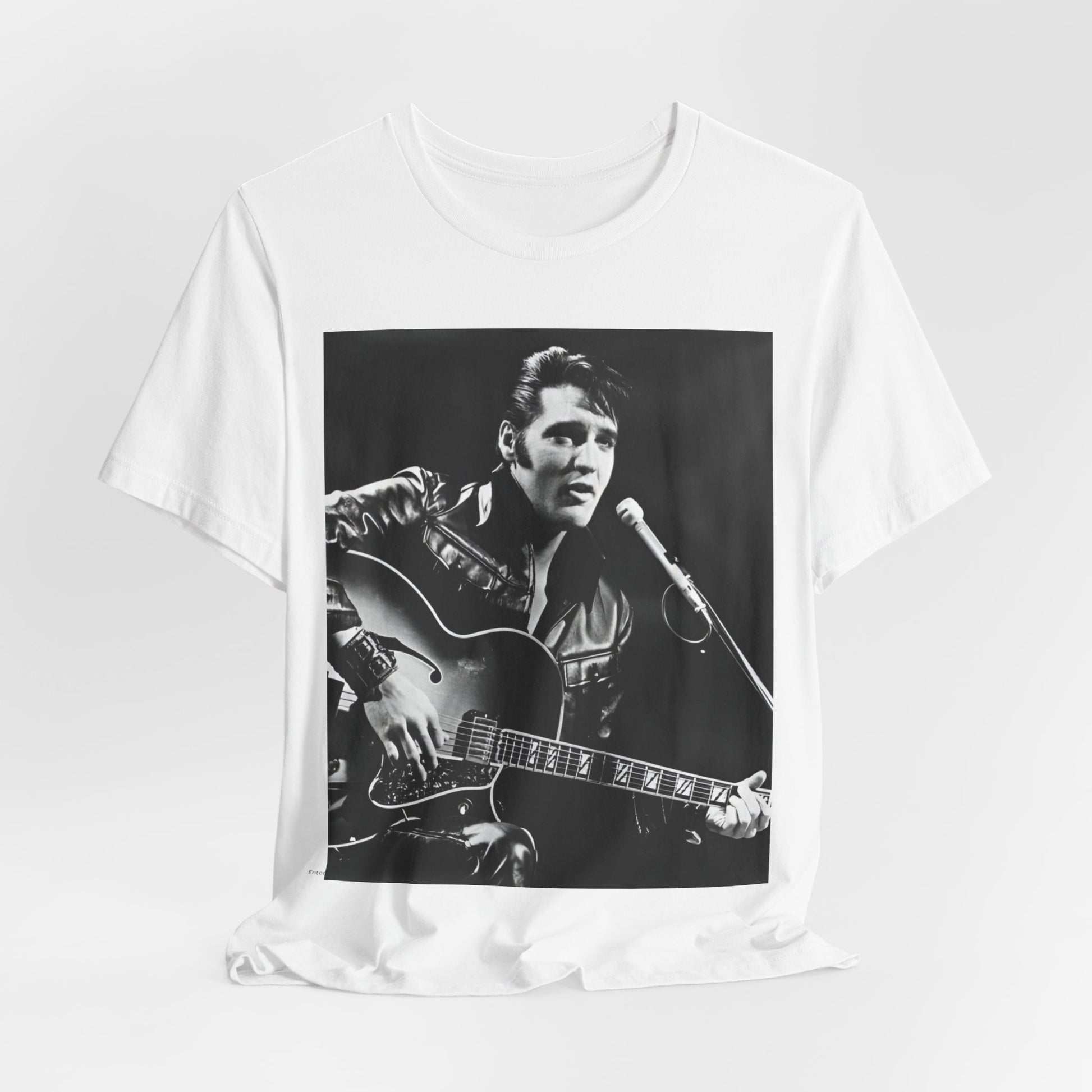A black graphic t-shirt featuring a graphic related to Elvis Presley's 'Burning Love' song or era.