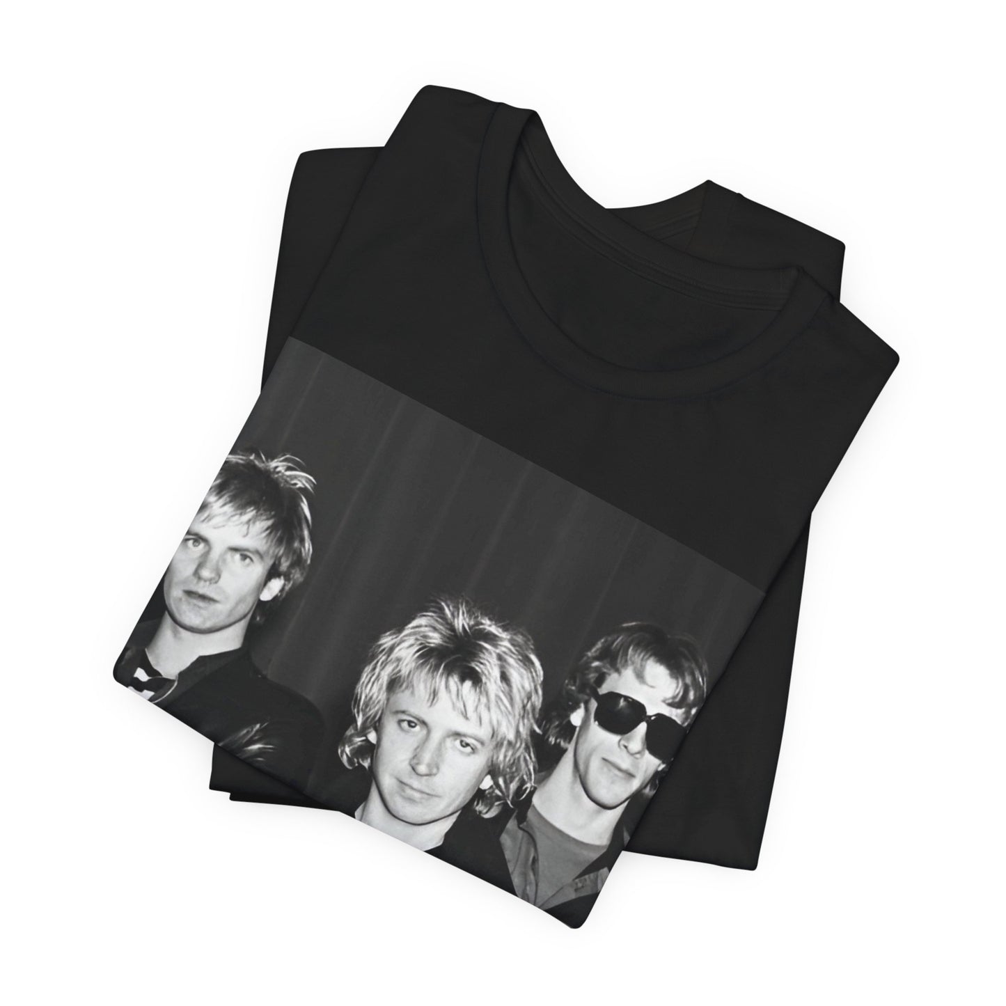 A black graphic t-shirt featuring a black and white, monochrome graphic or photo of The Police.