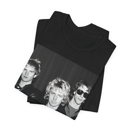 A black graphic t-shirt featuring a black and white, monochrome graphic or photo of The Police.
