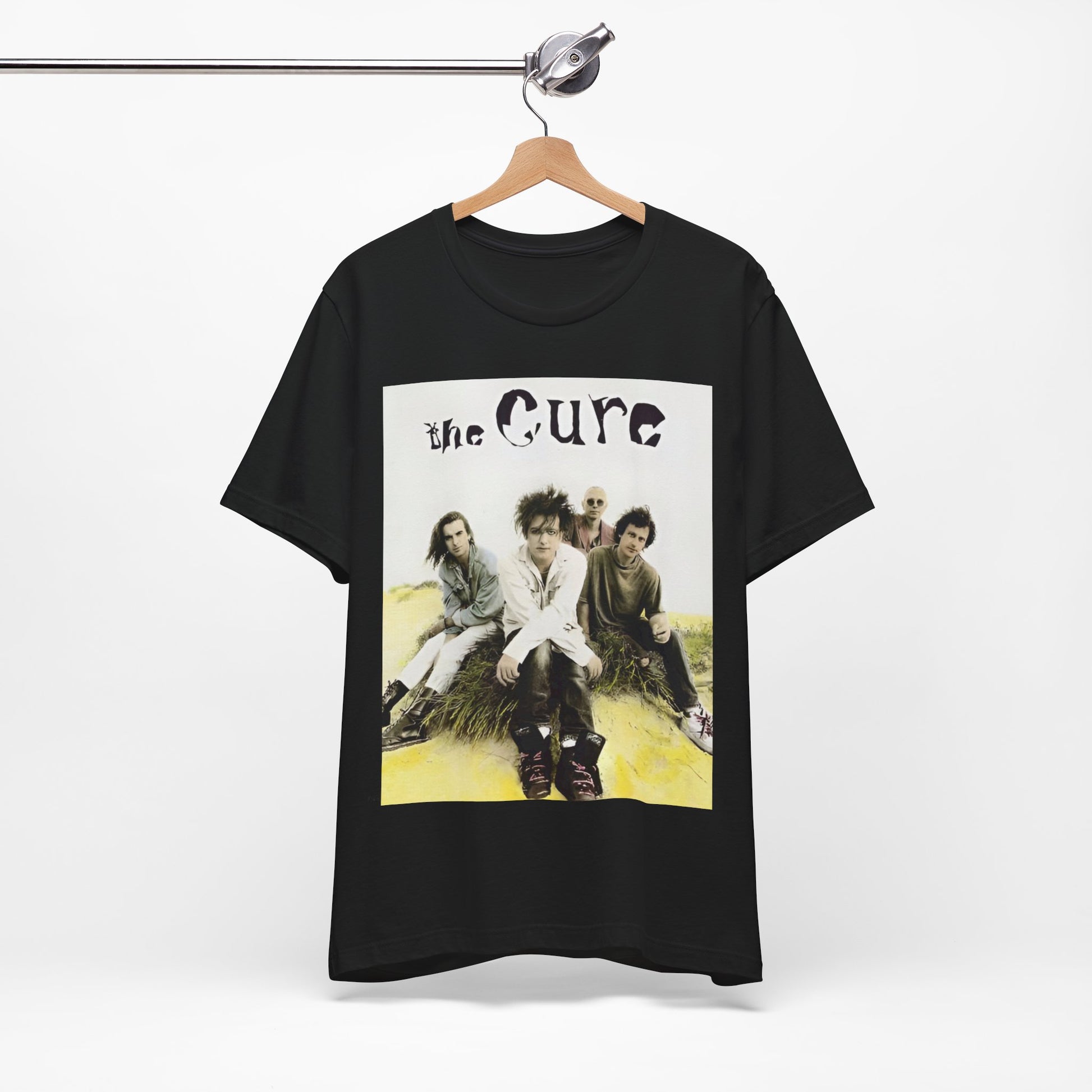 A black graphic t-shirt featuring a graphic of The Cure as post-punk pioneers.
