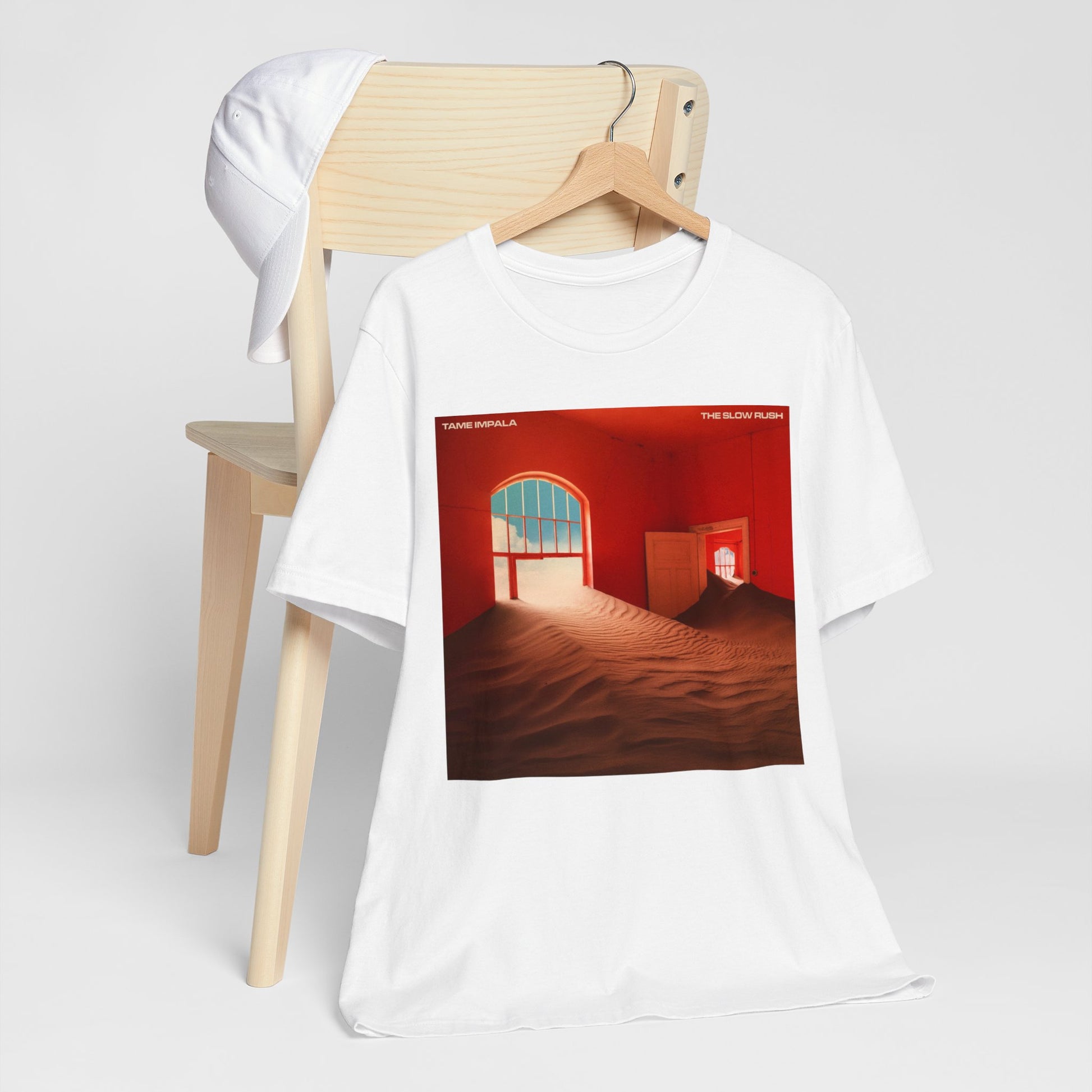 A black graphic t-shirt featuring a graphic related to Tame Impala's 'The Slow Rush' album.