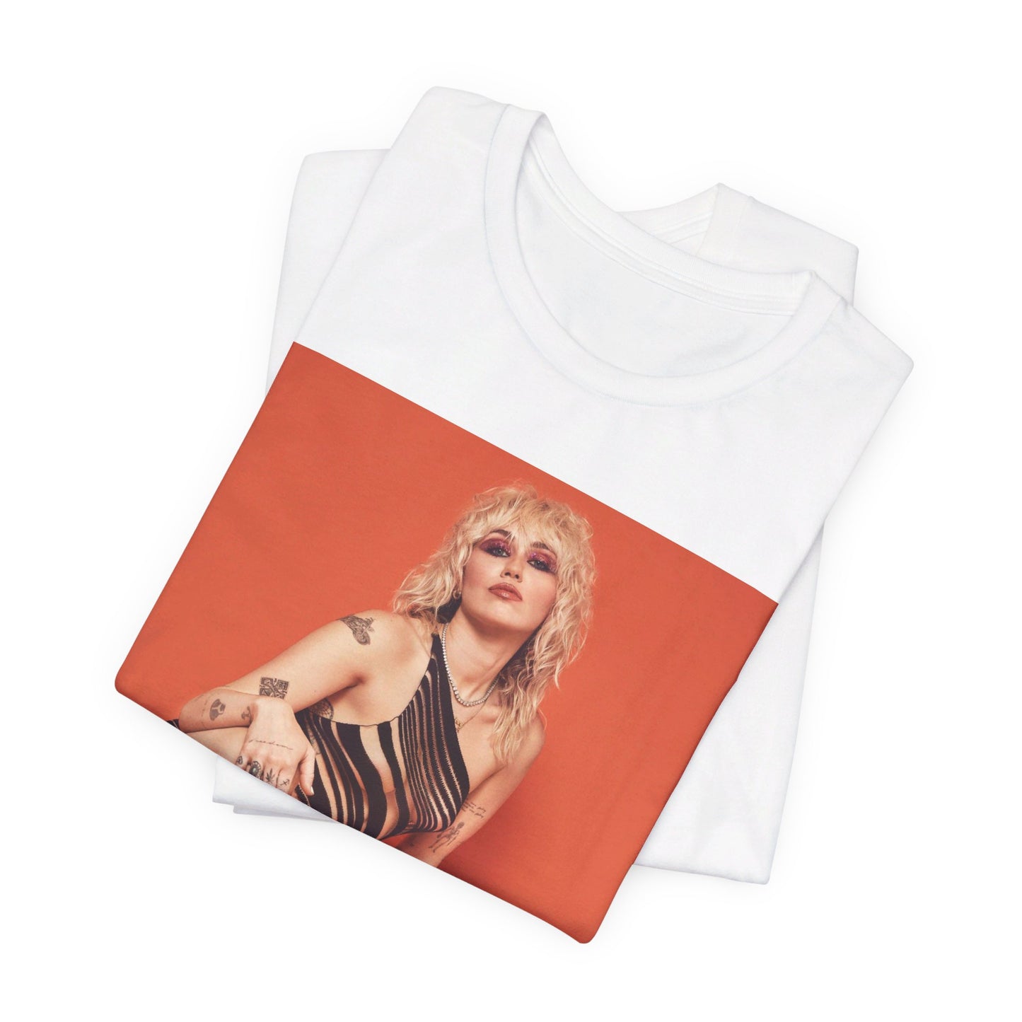 A black graphic t-shirt featuring a casual pop fan graphic of Miley Cyrus.