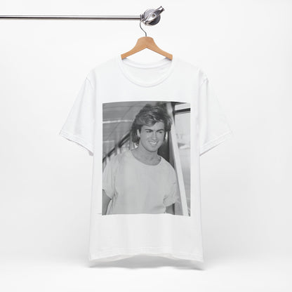 A black graphic t-shirt featuring an 80s black and white vintage photo or graphic of George Michael.