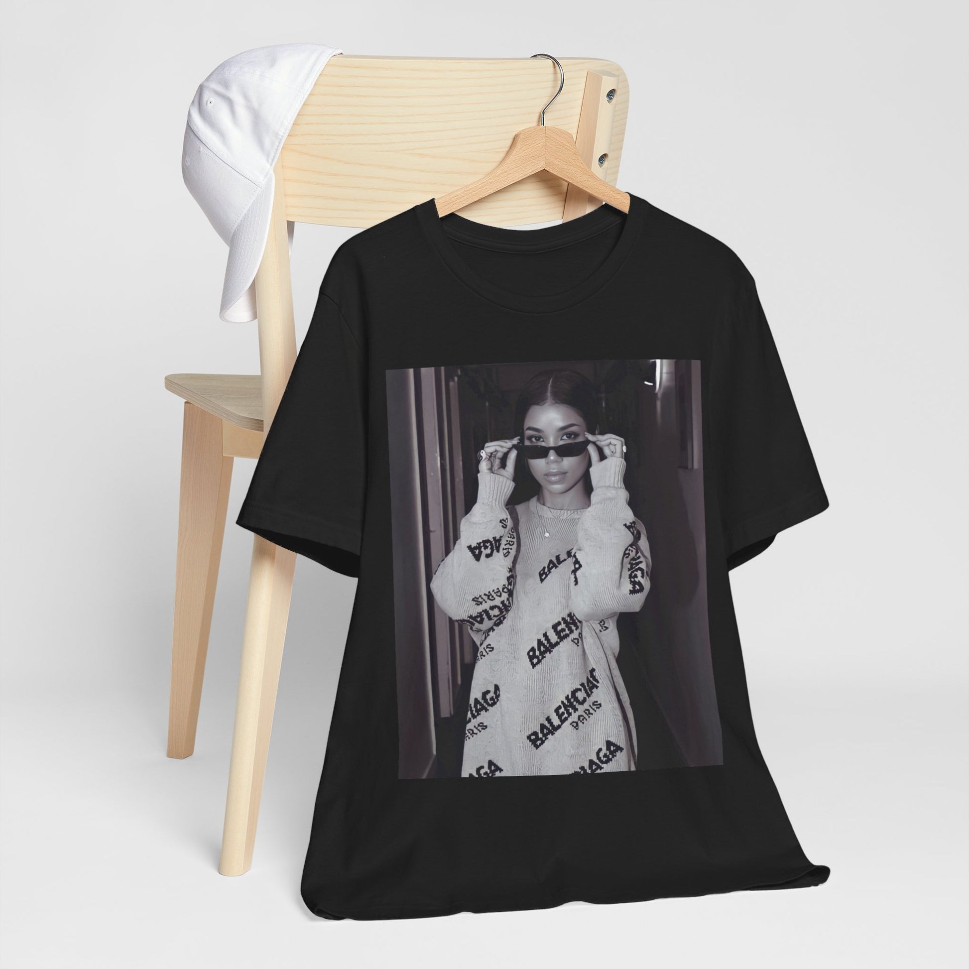 A black graphic t-shirt featuring a black and white, monochrome graphic or photo of Jhene Aiko.