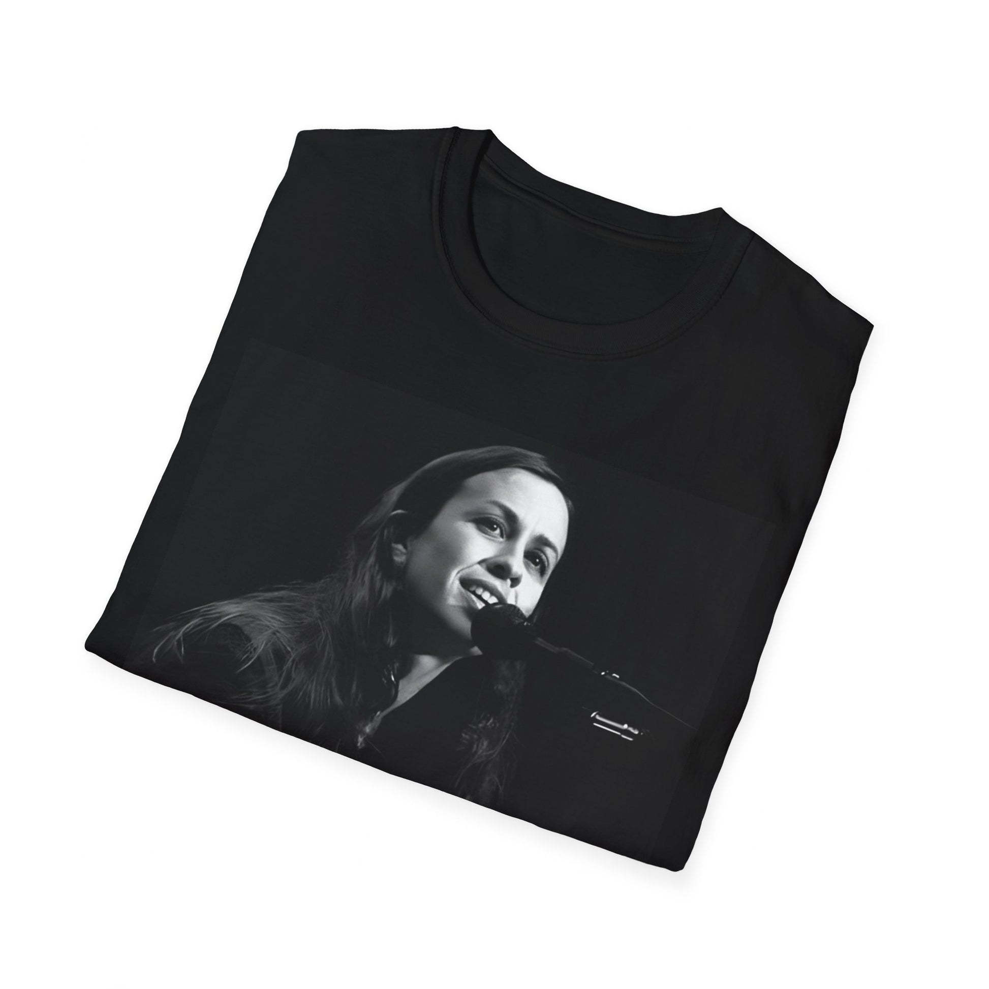 A black graphic t-shirt featuring a 90s-style graphic of Alanis Morissette on tour, possibly showing her performing or with tour elements.