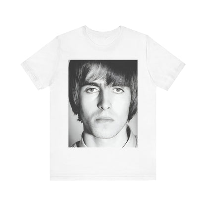 A black graphic t-shirt featuring a 90s portrait photo of Liam Gallagher from Oasis.