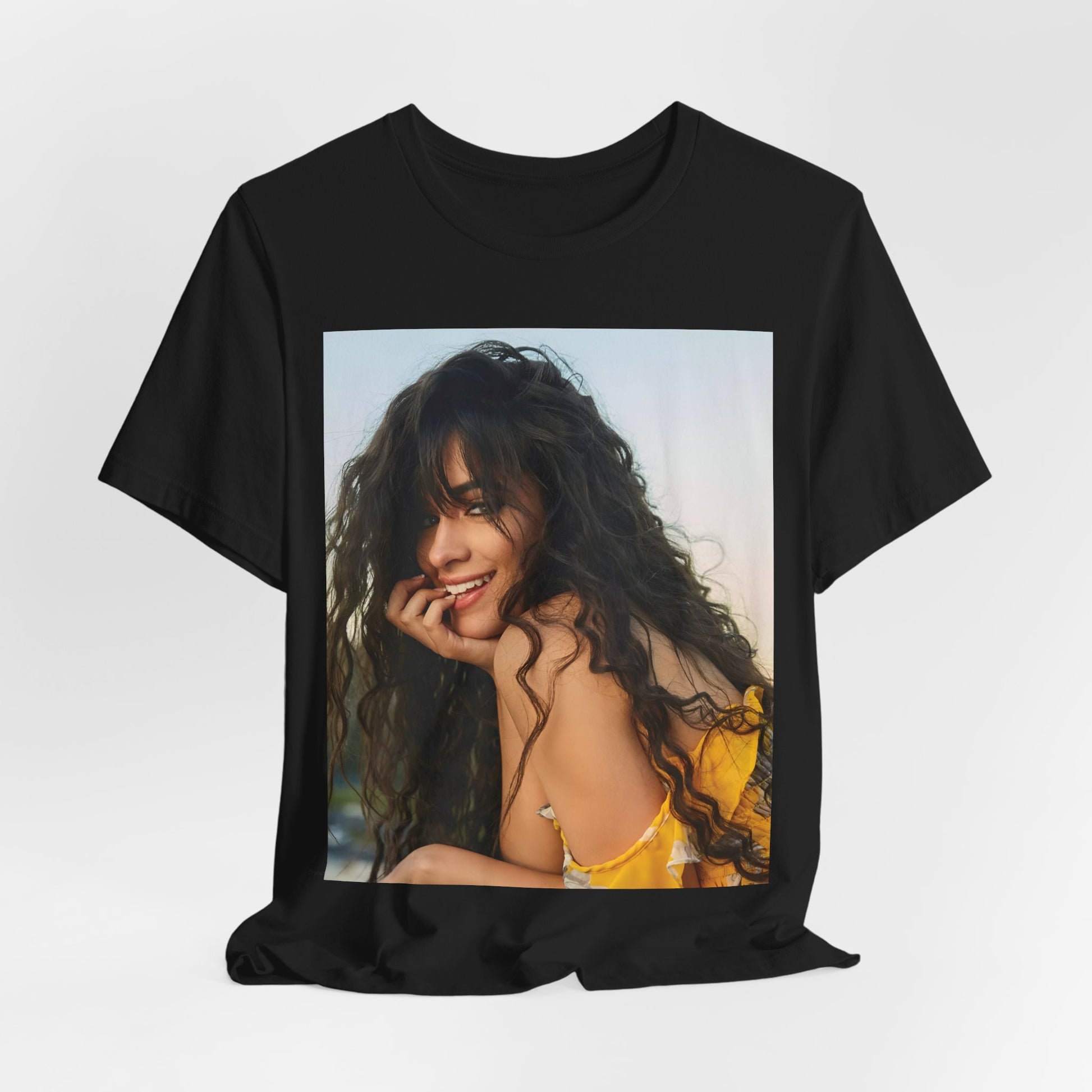 A black graphic t-shirt featuring a graphic inspired by Camila Cabello's "Don't Go Yet" song or era.