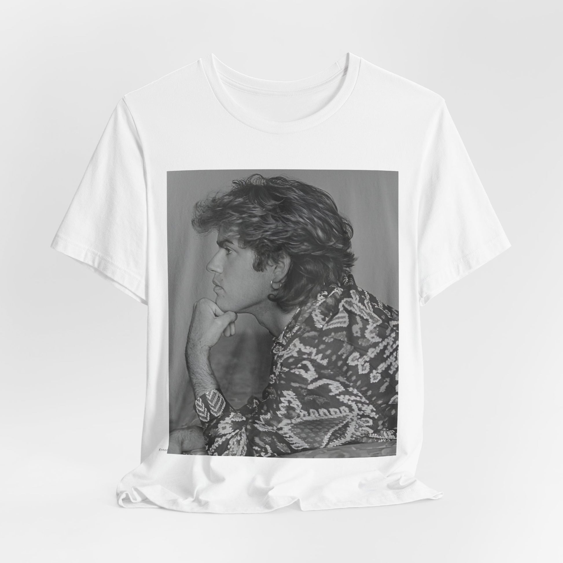 A black graphic t-shirt featuring a graphic of George Michael from his 80s Wham! era.