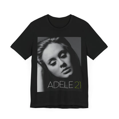 A black graphic t-shirt featuring the album cover art for Adele's '21' album, showing a close-up portrait of her with a contemplative expression.