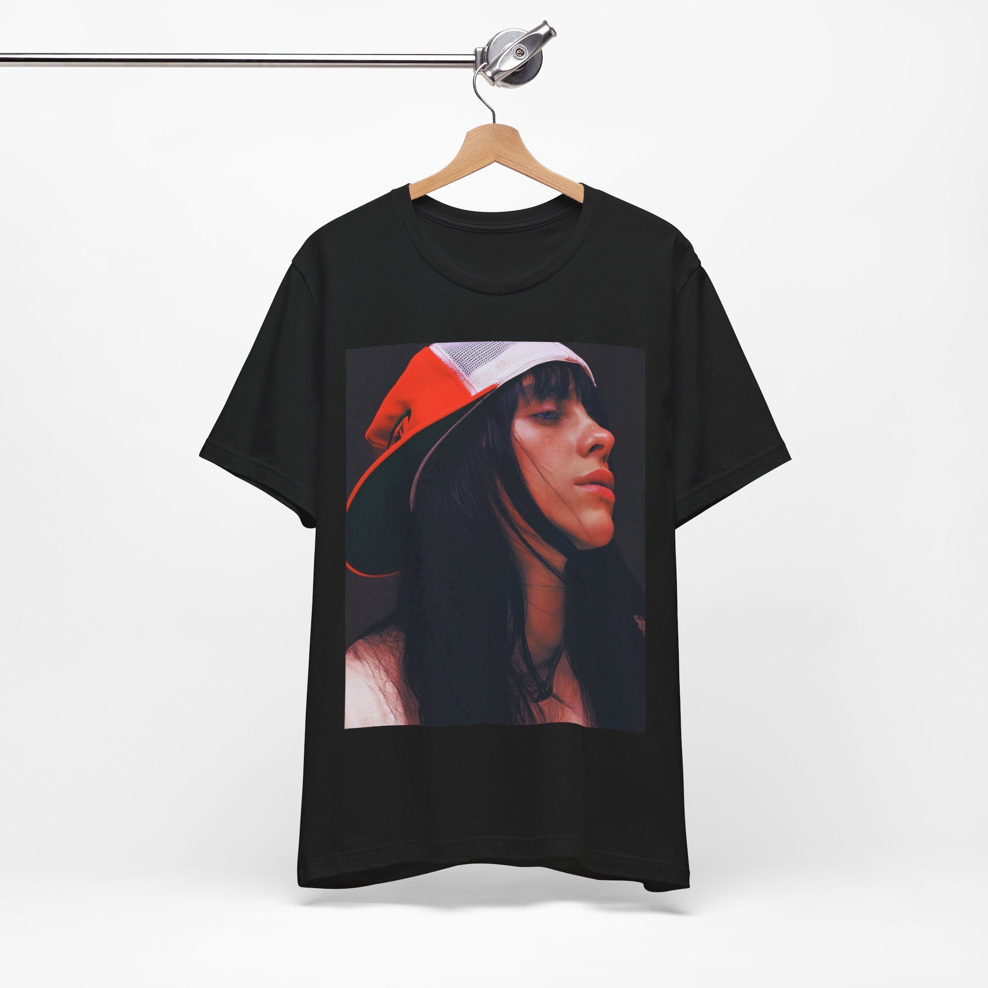 A graphic t-shirt featuring the name 'Billie Eilish' in a raw, urban street-style font.