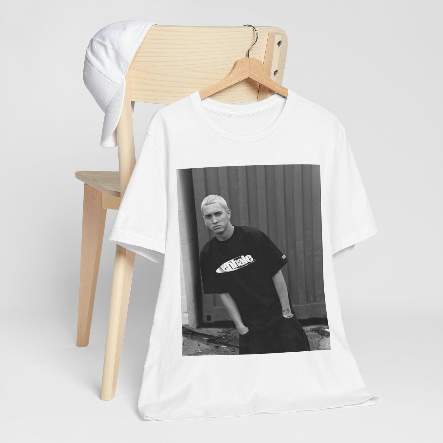 A black graphic t-shirt featuring a graphic of Eminem with a Detroit hip hop aesthetic.