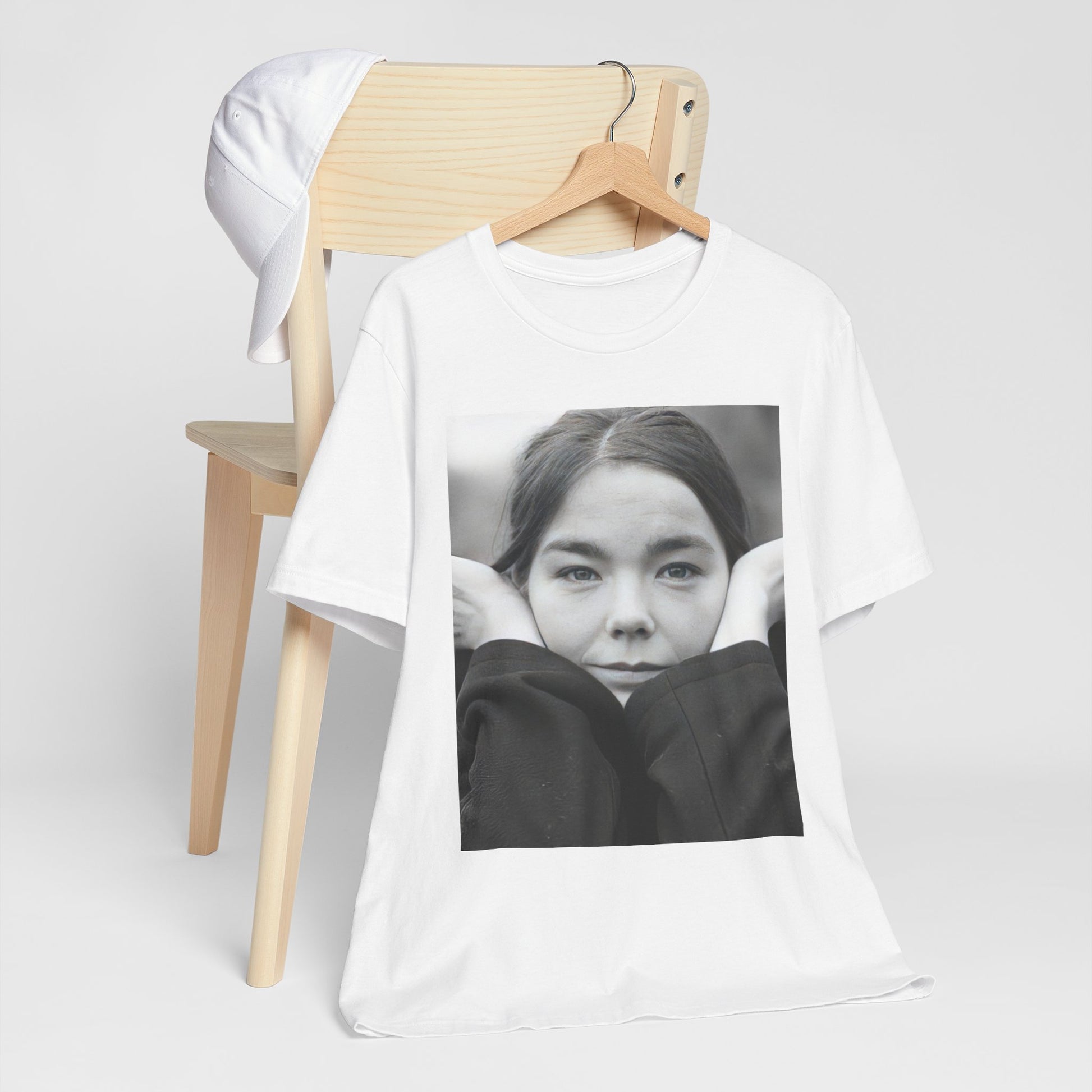 A black graphic t-shirt featuring a black and white portrait photo of Bjork.