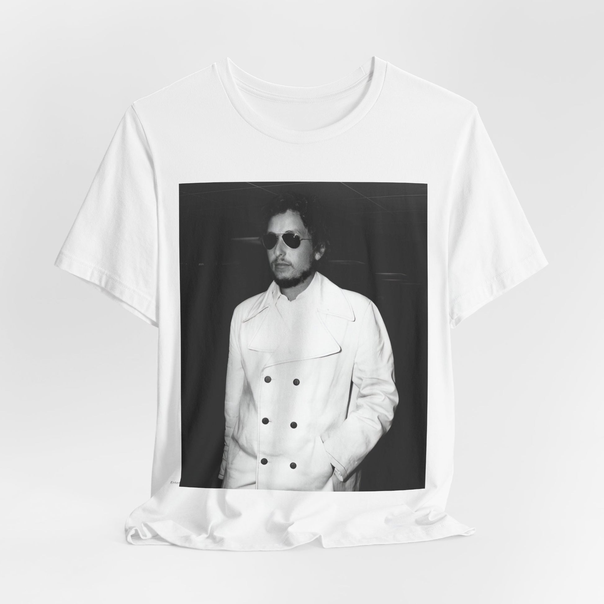 A black graphic t-shirt featuring a vintage black and white photo of Bob Dylan in a contemplative or iconic pose.