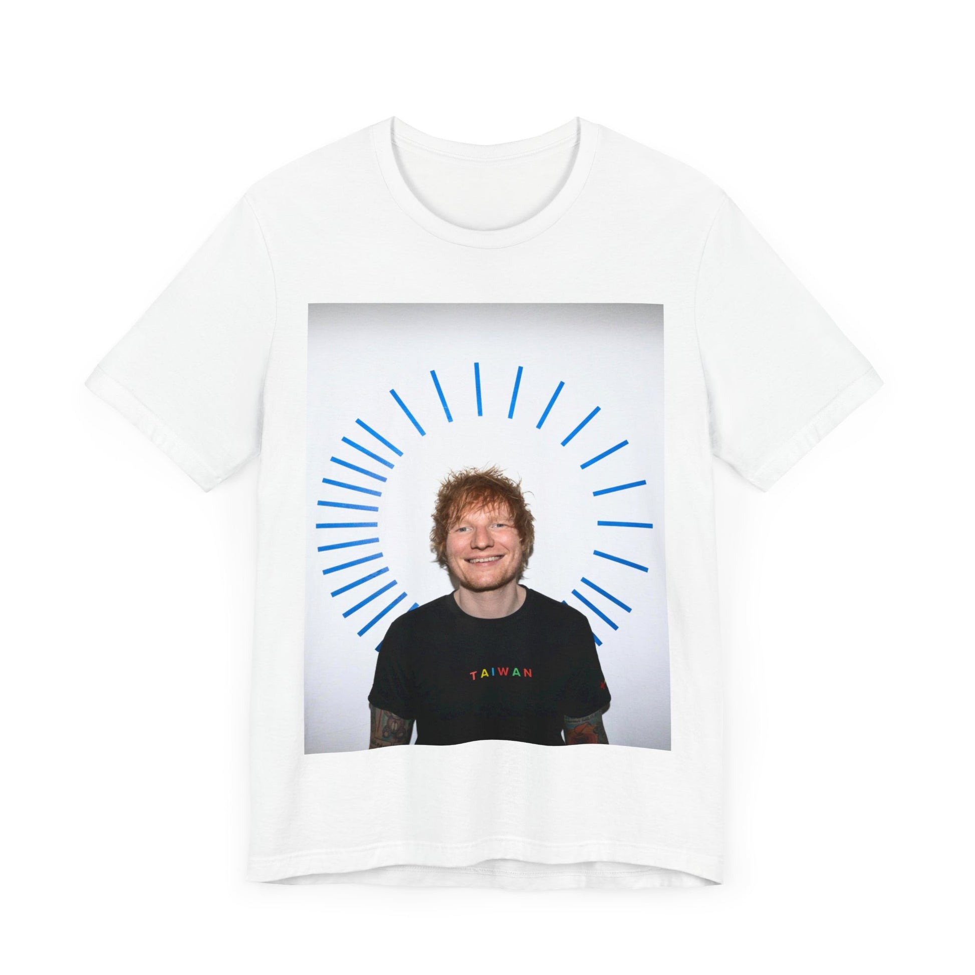 A black graphic t-shirt featuring a classic photo portrait of Ed Sheeran in a folk-pop style.