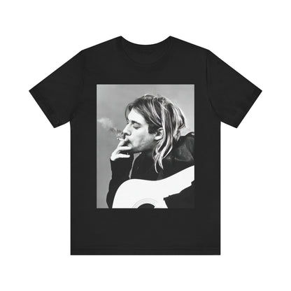 A black graphic t-shirt featuring a vintage photo of a Nirvana member with a cigarette.
