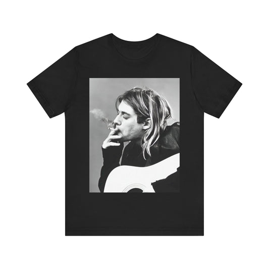 A black graphic t-shirt featuring a vintage photo of a Nirvana member with a cigarette.