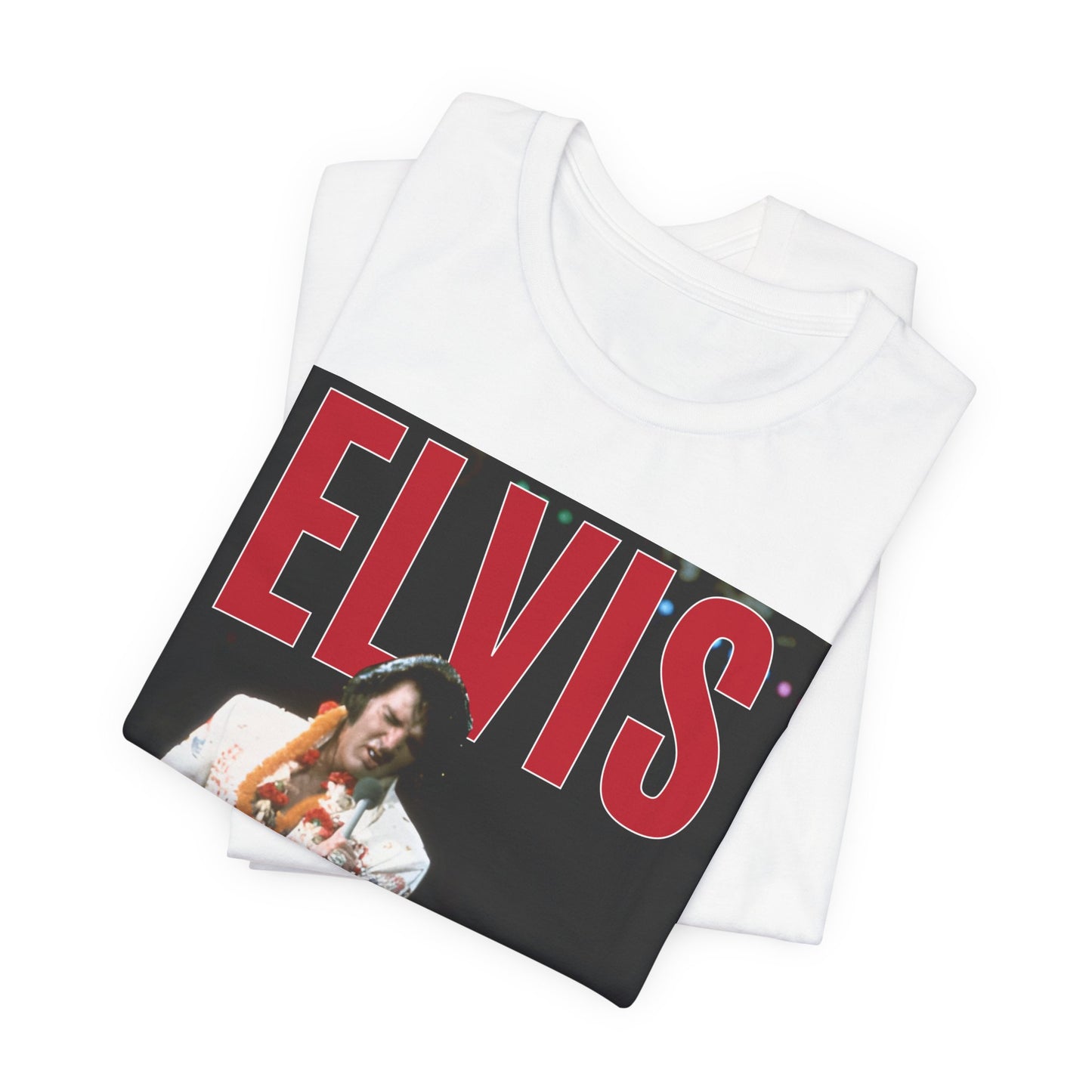 A black graphic t-shirt featuring a glamorous graphic or photo of Elvis Presley on a Las Vegas stage.