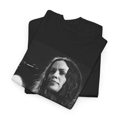 A black graphic t-shirt featuring a 90s-style graphic of Alanis Morissette playing a guitar, with a dynamic expression.