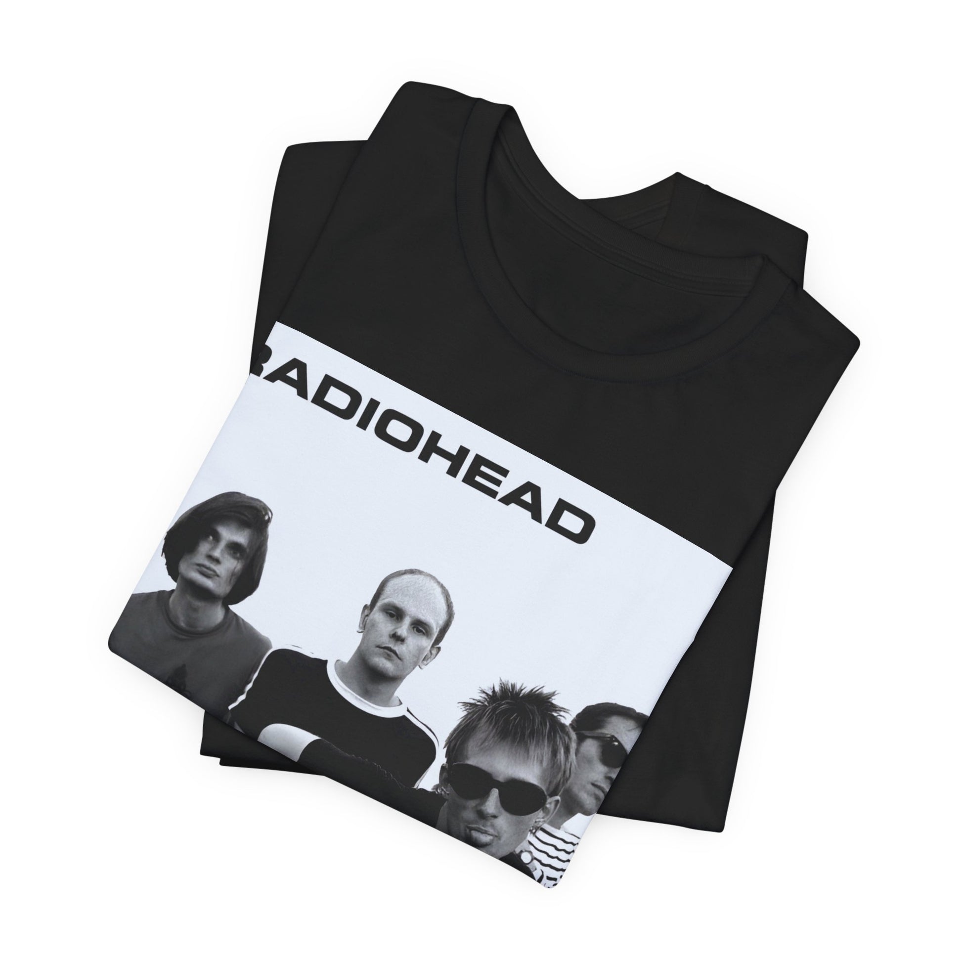 A black graphic t-shirt featuring a vintage 90s graphic related to Radiohead's 'Creep' song or era.