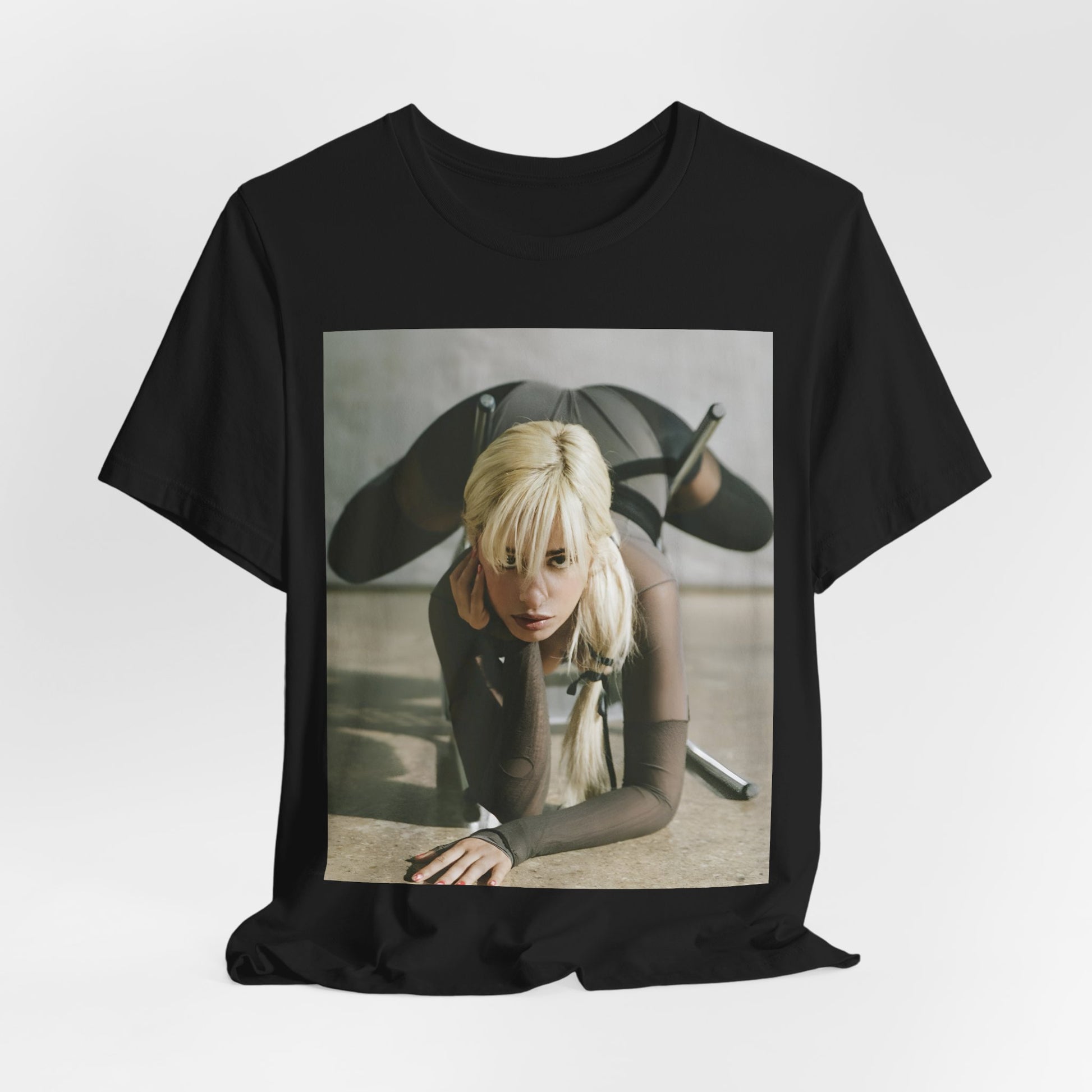 A black graphic t-shirt featuring a vintage-style graphic of Camila Cabello, possibly with a crown or 'Pop Queen' title.