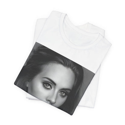 A black graphic t-shirt featuring a classic black and white, monochrome portrait of Adele, showing her with a serene or thoughtful expression.
