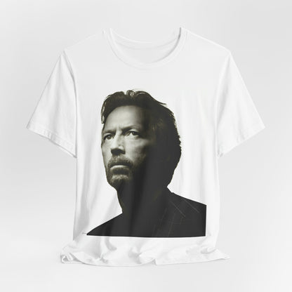 A black graphic t-shirt featuring a retro black and white portrait photo of Eric Clapton.