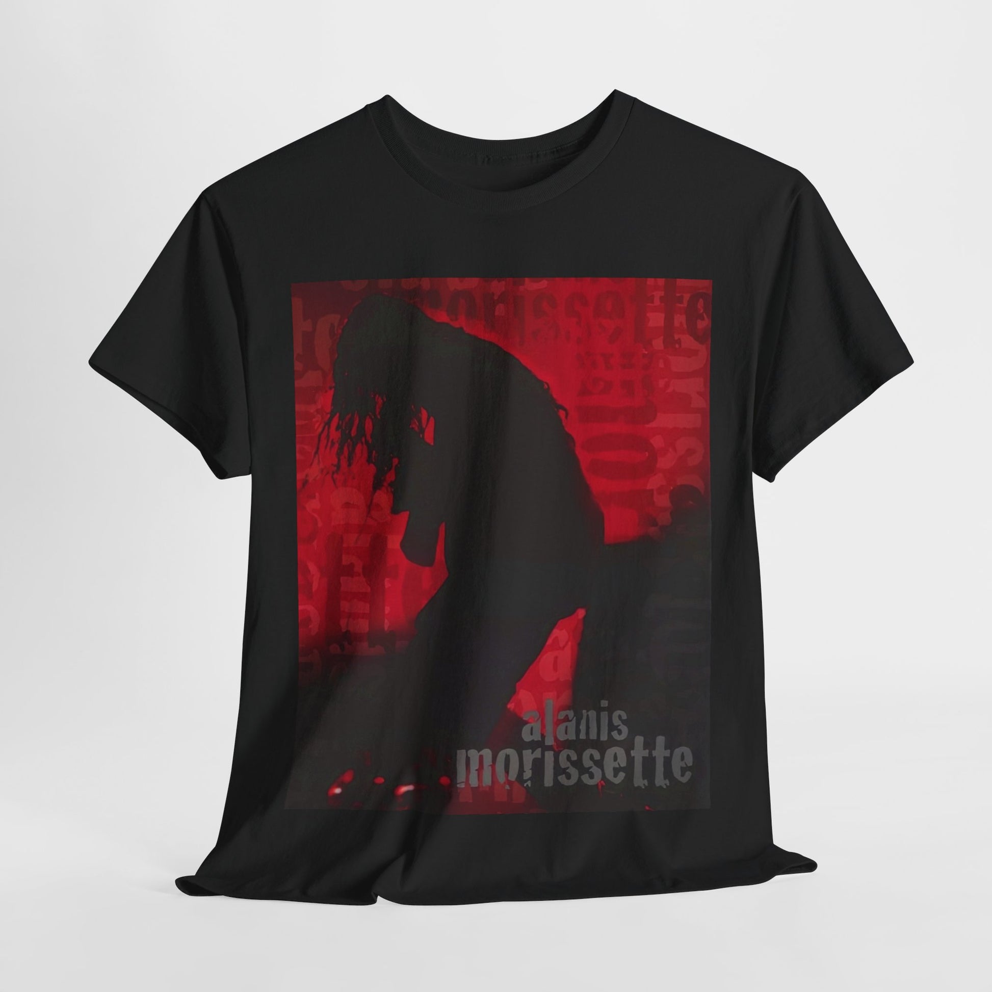 A black graphic t-shirt featuring a promotional graphic for an Alanis Morissette tour from the 2000s, possibly with stylized text and band imagery.