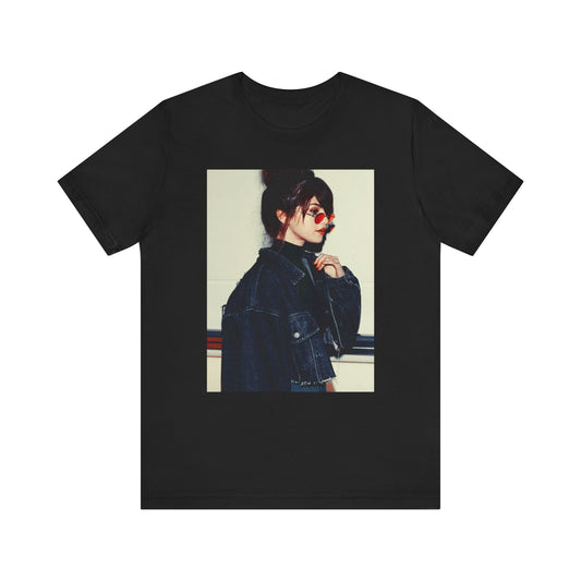 A black graphic t-shirt featuring a bold graphic of Selena Gomez as a pop superstar.