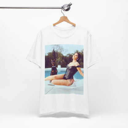 A black graphic t-shirt featuring a graphic related to Cardi B's 'I Like It' song, with bold pop culture elements.