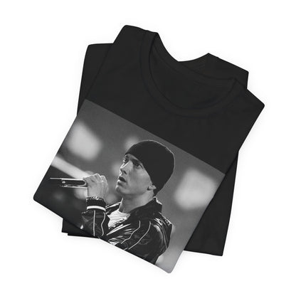 A black graphic t-shirt featuring a classic 90s graphic of Eminem as a 'Rap God'.