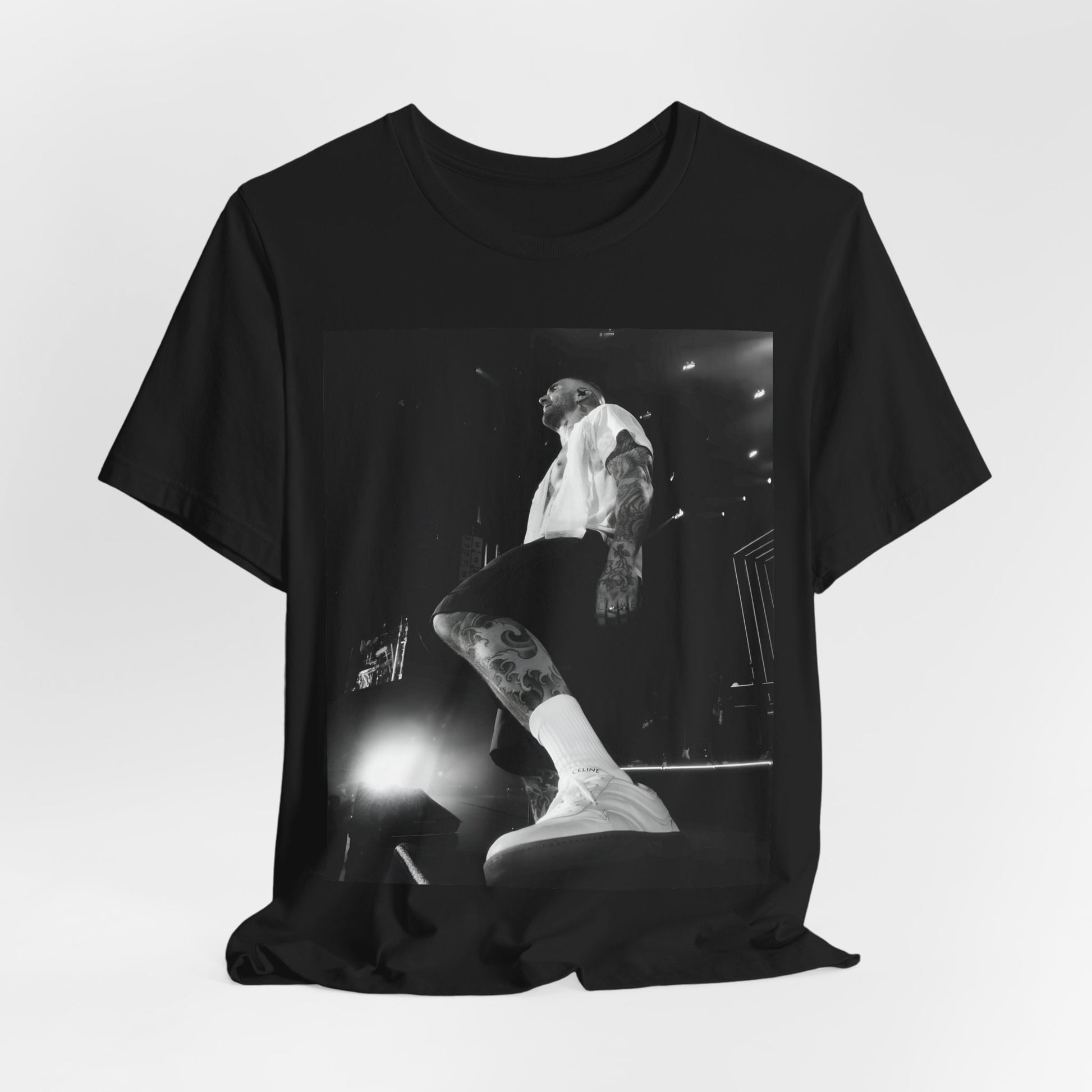 The abstract, geometric 'V' logo from the cover of the Maroon 5 album V, printed on a t-shirt.