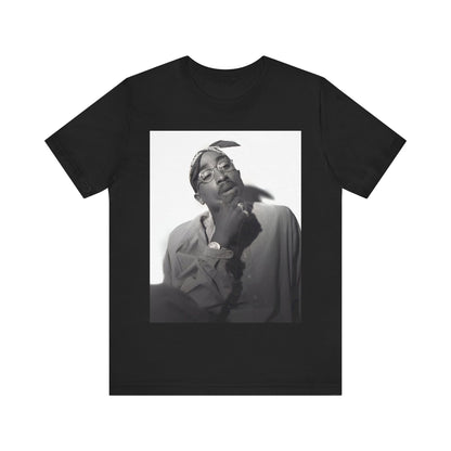 A black graphic t-shirt featuring a classic 90s West Coast rap graphic of Tupac.