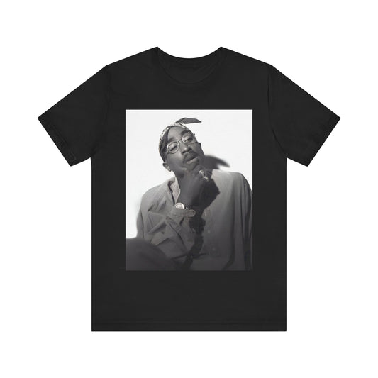 A black graphic t-shirt featuring a classic 90s West Coast rap graphic of Tupac.
