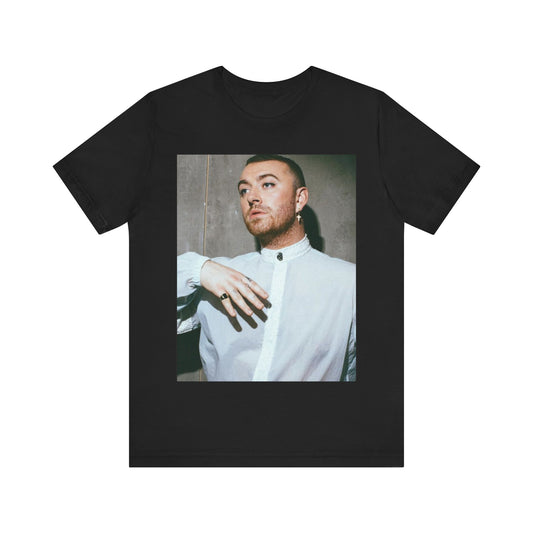 A black graphic t-shirt featuring a vintage graphic of Sam Smith emphasizing their soulful voice.
