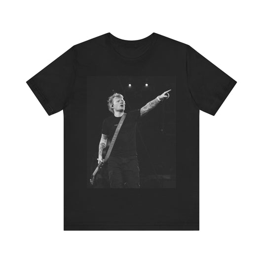 A black graphic t-shirt featuring a black and white graphic or photo of Ed Sheeran performing live on stage.