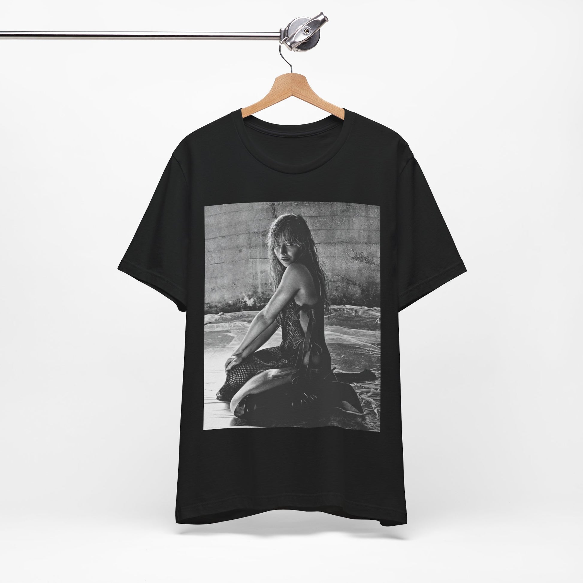 A black graphic t-shirt featuring a black and white, monochrome graphic or photo of Sabrina Carpenter.